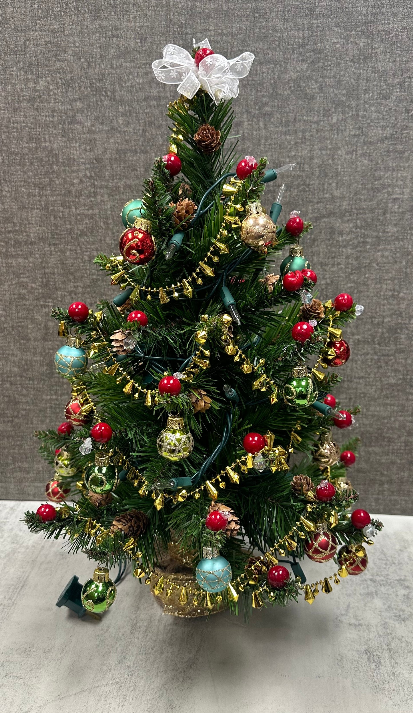 18” mini lighted Christmas Tree with gold accents, cranberries, pinecones, and ornaments-made by hand