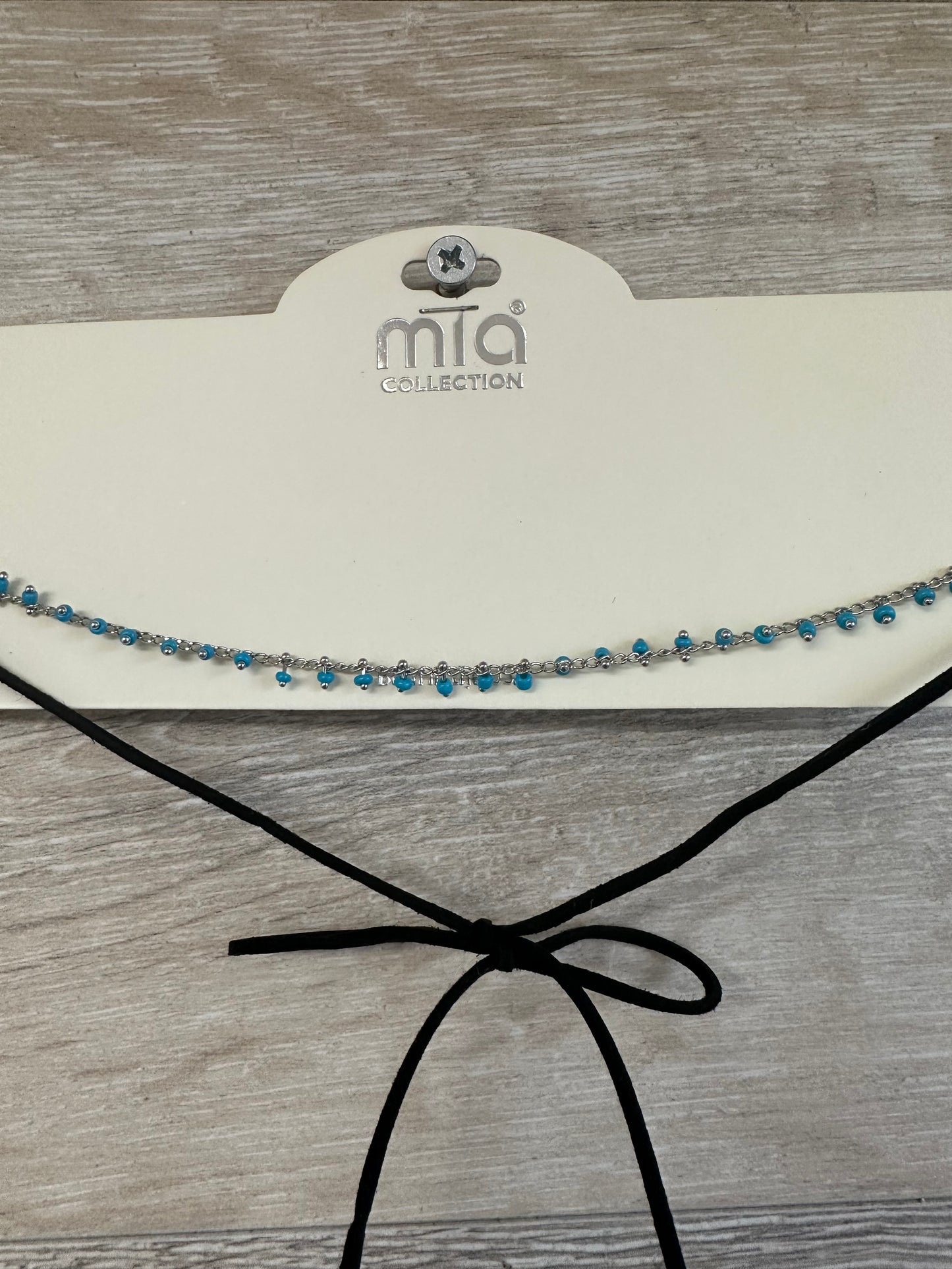 Mia Collection turquoise seed beads on silver choker necklace with black faux leather ties